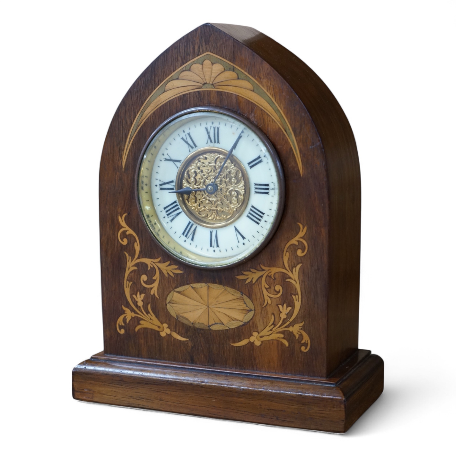 An Edwardian inlaid mahogany lancet shaped eight day mantel timepiece, with key, 23cm high